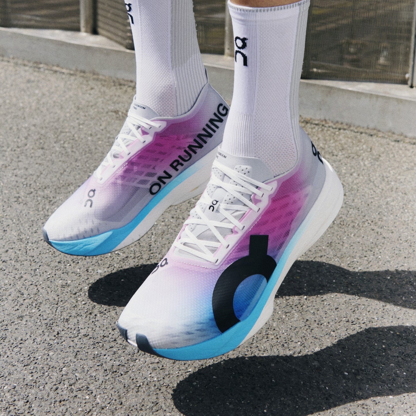 On Cloudboom Strike | White / Horizon | Womens