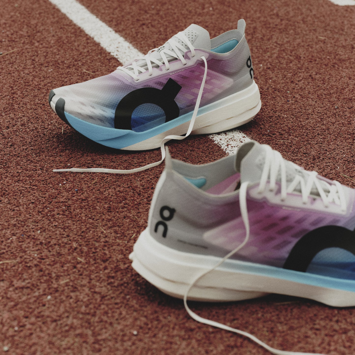 On Cloudboom Strike | White / Horizon | Womens