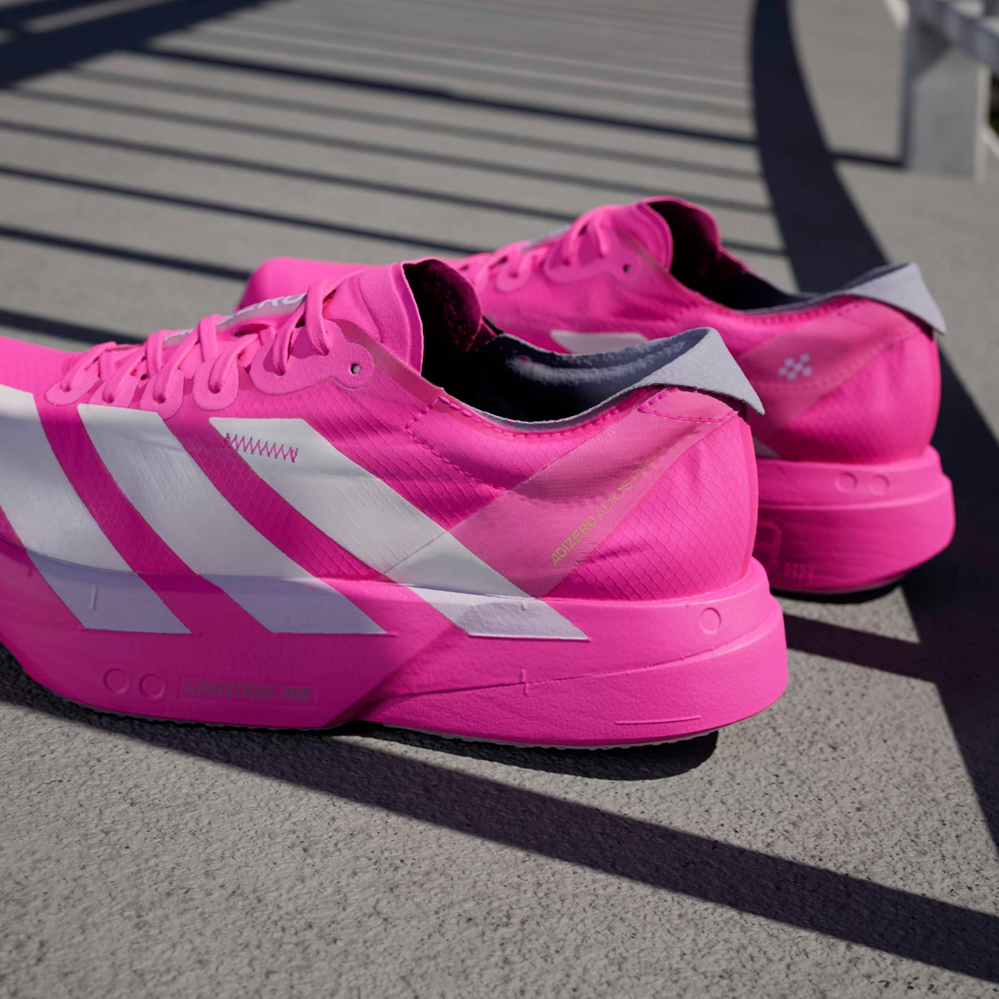 adidas Adizero Adios Pro 4 | Shock Pink / Zero Metallic / Aurora Plum | Womens