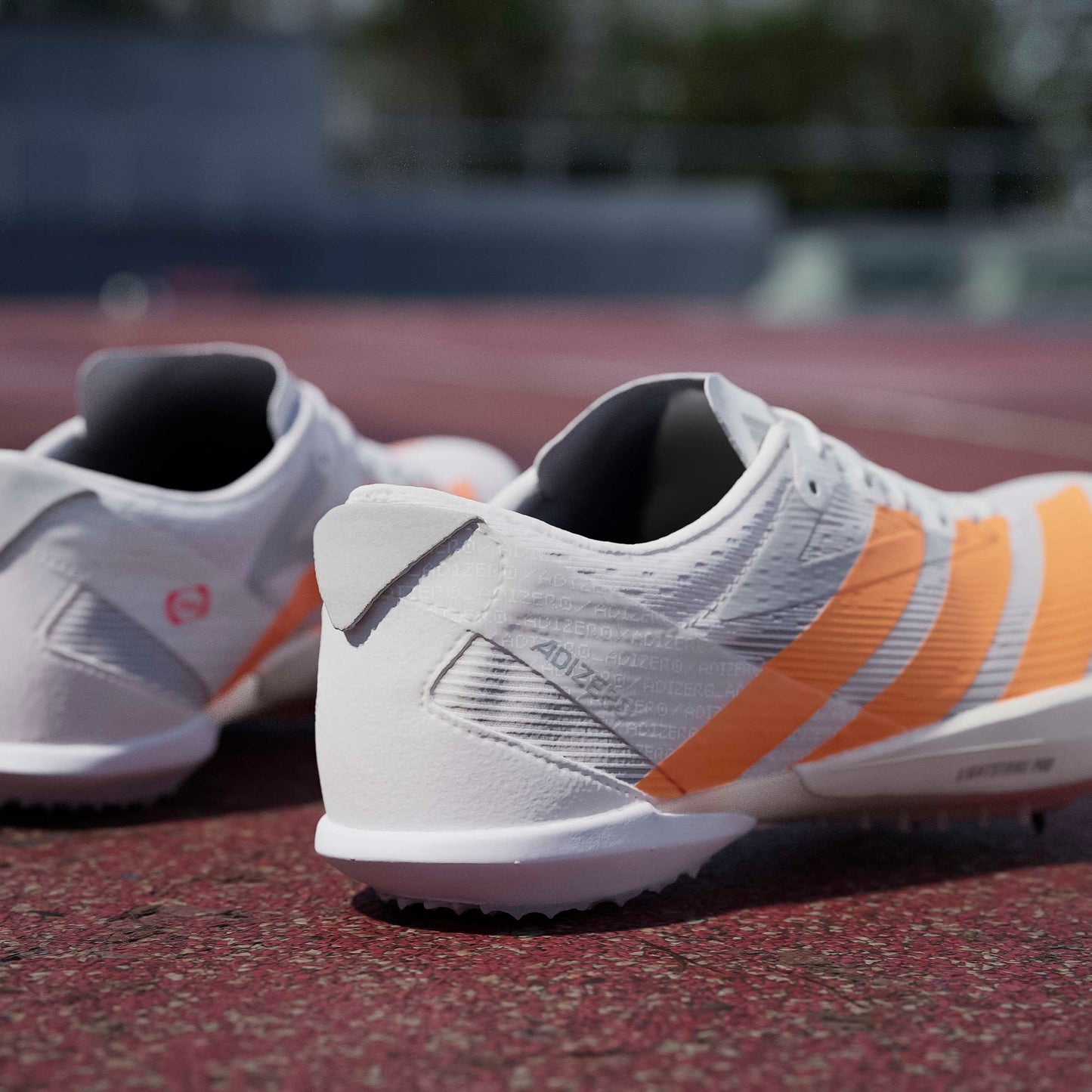 adidas Adizero Ambition Spikes | Cloud White / Lucid Orange / Lucid Red | Unisex